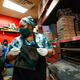 Marquisha Byrd makes acrylic face shields for front line responders at Dimo’s Pizza in Chicago, Illinois, on April 16, 2020